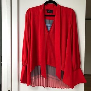Red, back pleated shirt. Perfect condition.